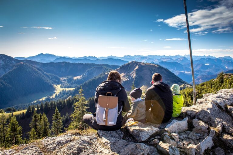 family on mountain with backpacks
