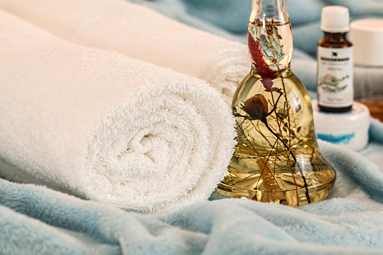 massage therapy with towel and massage oil